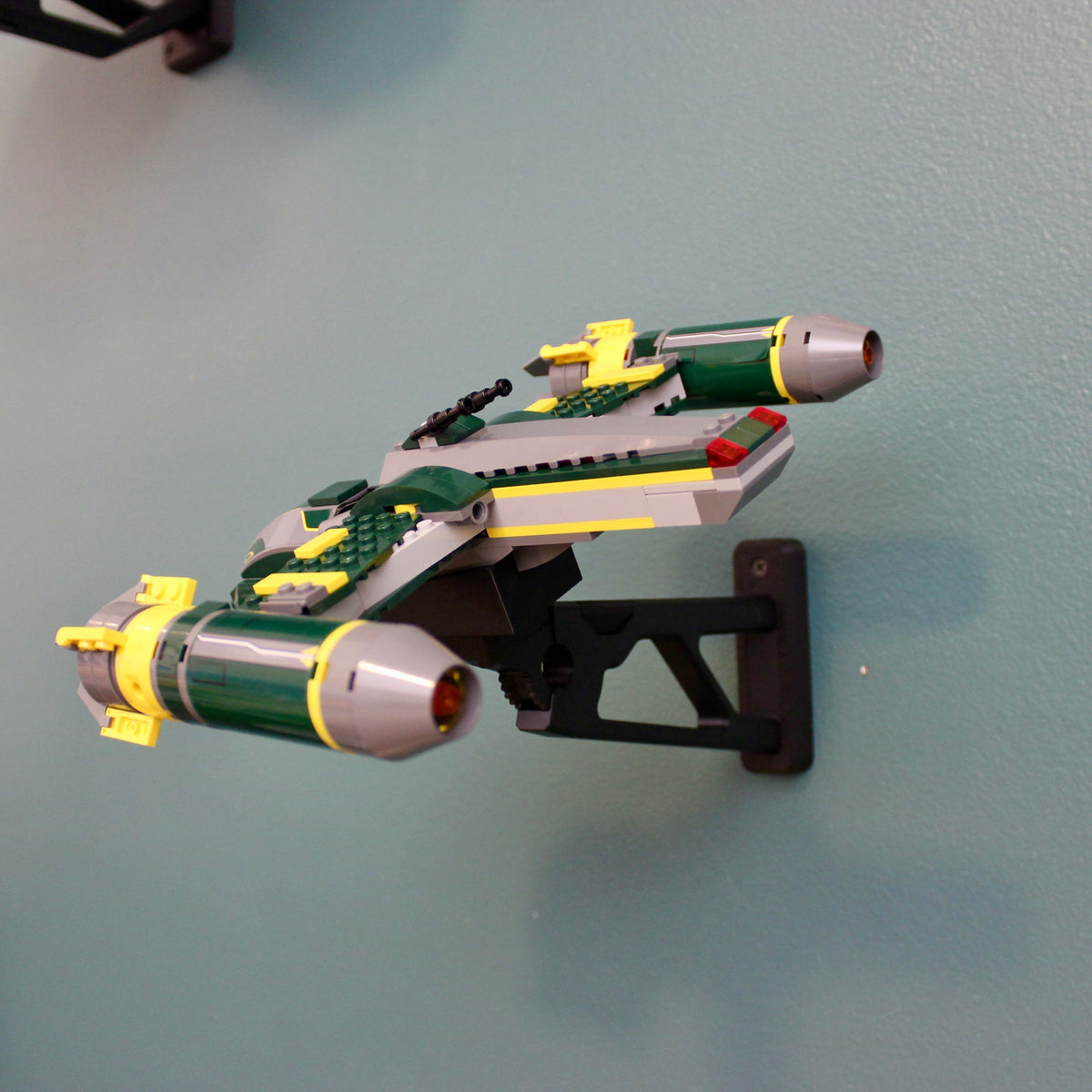 LEGO Bounty Hunter Assault Gunship 7930 on the wall mount, side view showing the black mount arm