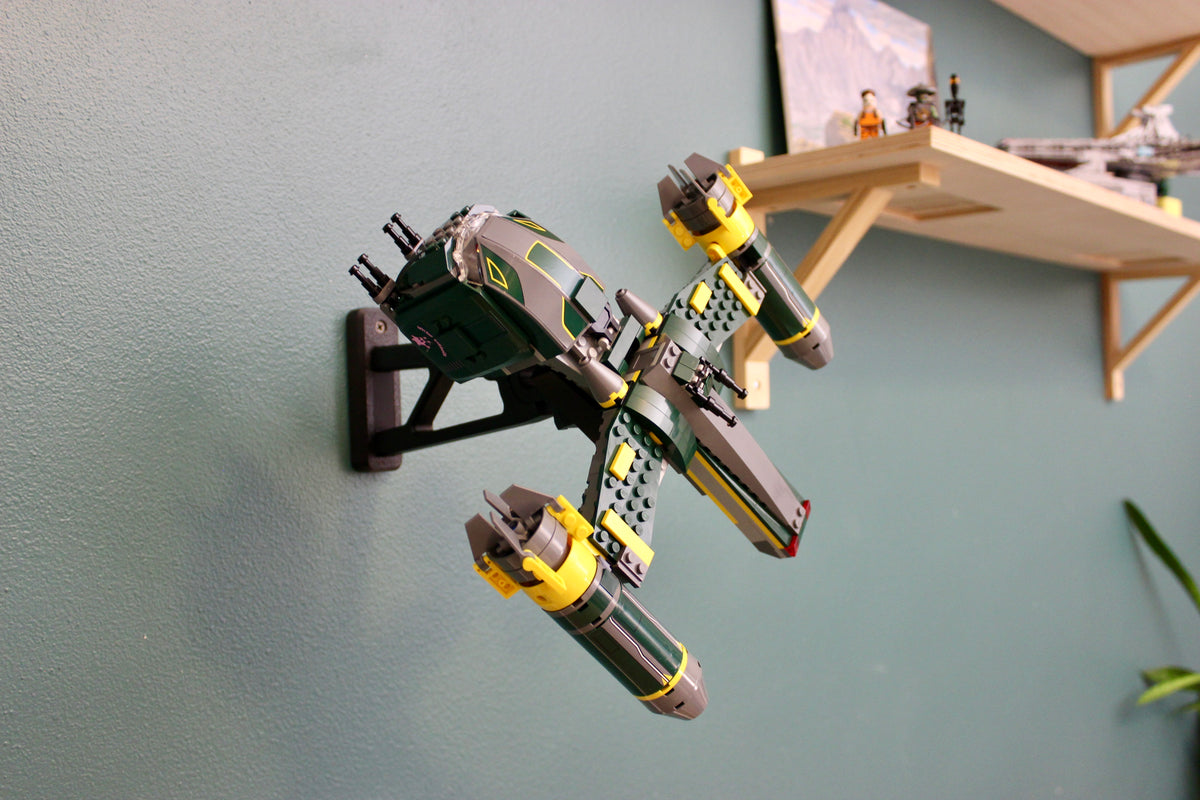 LEGO Bounty Hunter Assault Gunship 7930 angled on its wall mount beside a wooden shelf