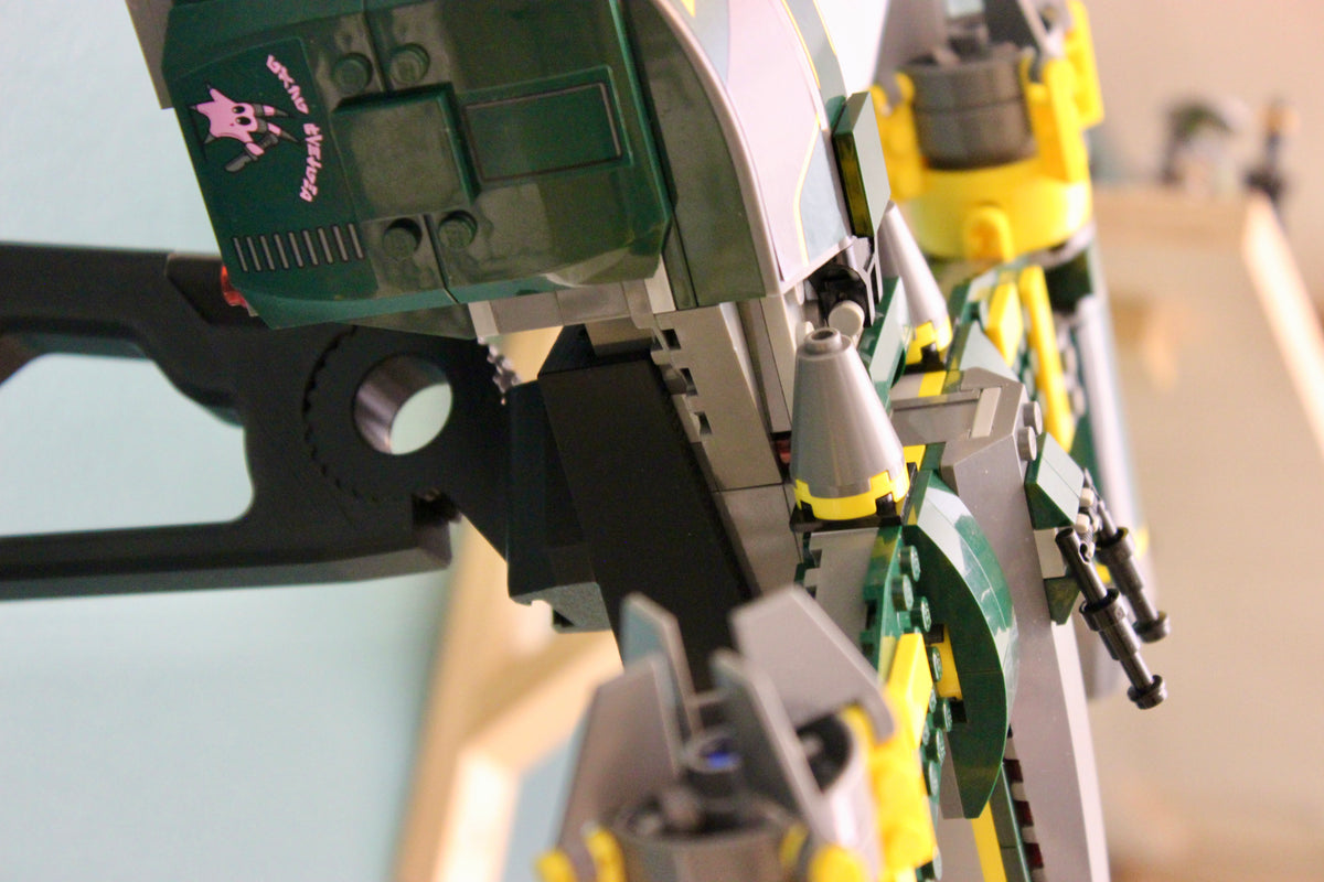 Close-up of the black wall mount's gear hinge holding the LEGO Bounty Hunter Assault Gunship 7930