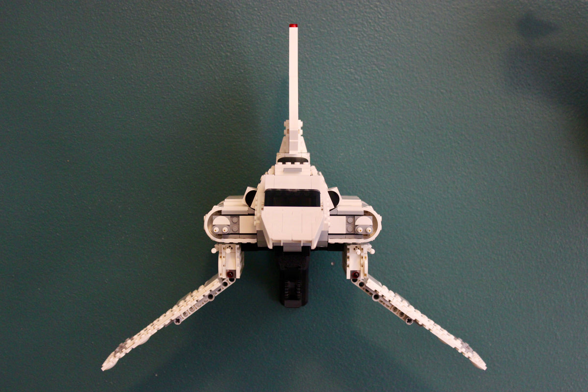 LEGO Imperial Lambda-Class Shuttle 75459 mounted on the wall with its wings lowered, front view