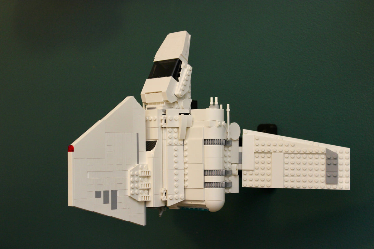 LEGO Imperial Lambda-Class Shuttle 75459 turned on its side on the wall mount, wings spread