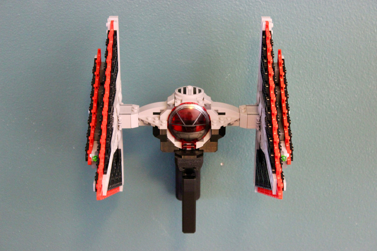 LEGO Sith TIE Fighter 75272 mounted level on the wall, front view showing the black wall mount