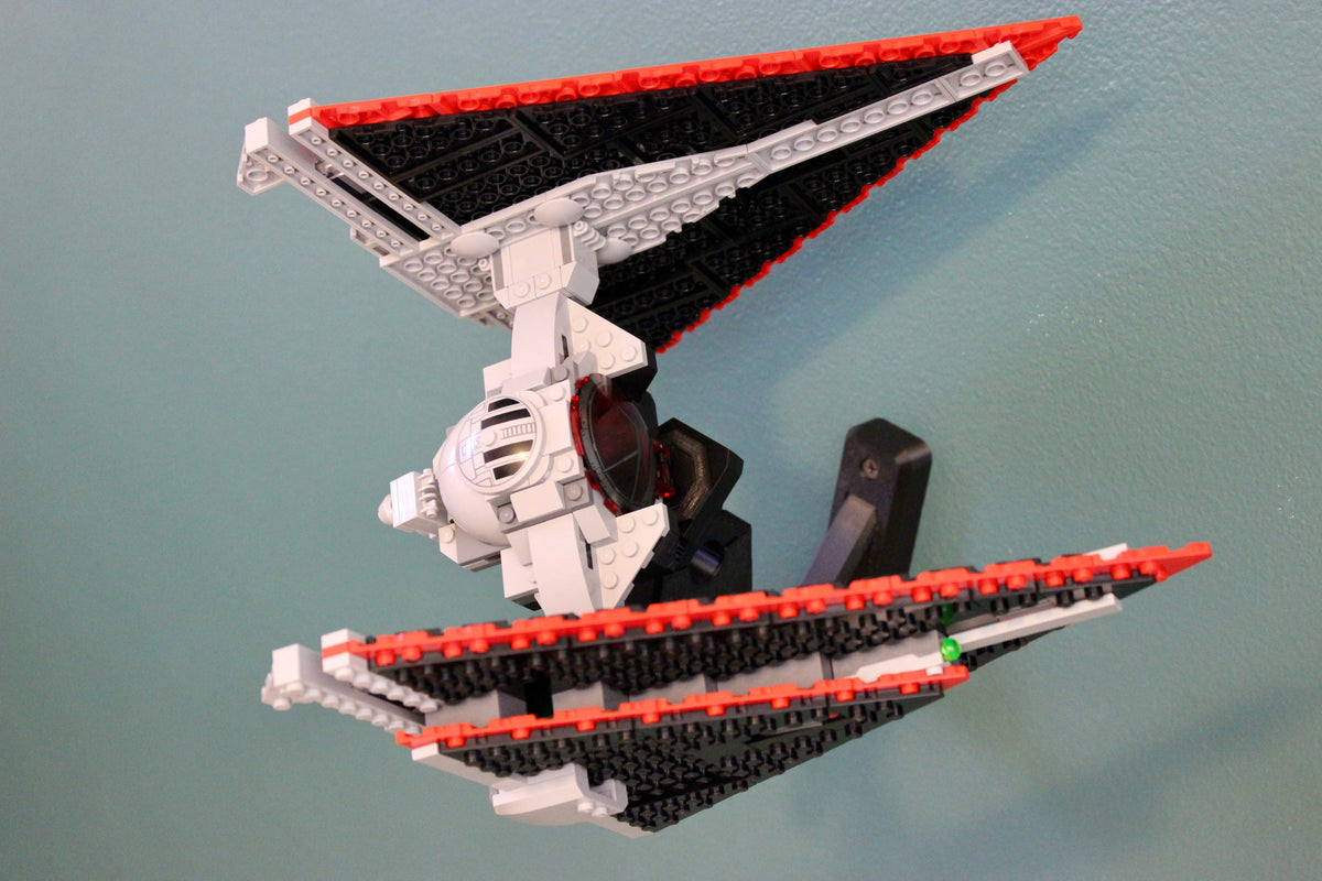LEGO Sith TIE Fighter 75272 tilted on the wall mount, seen from below