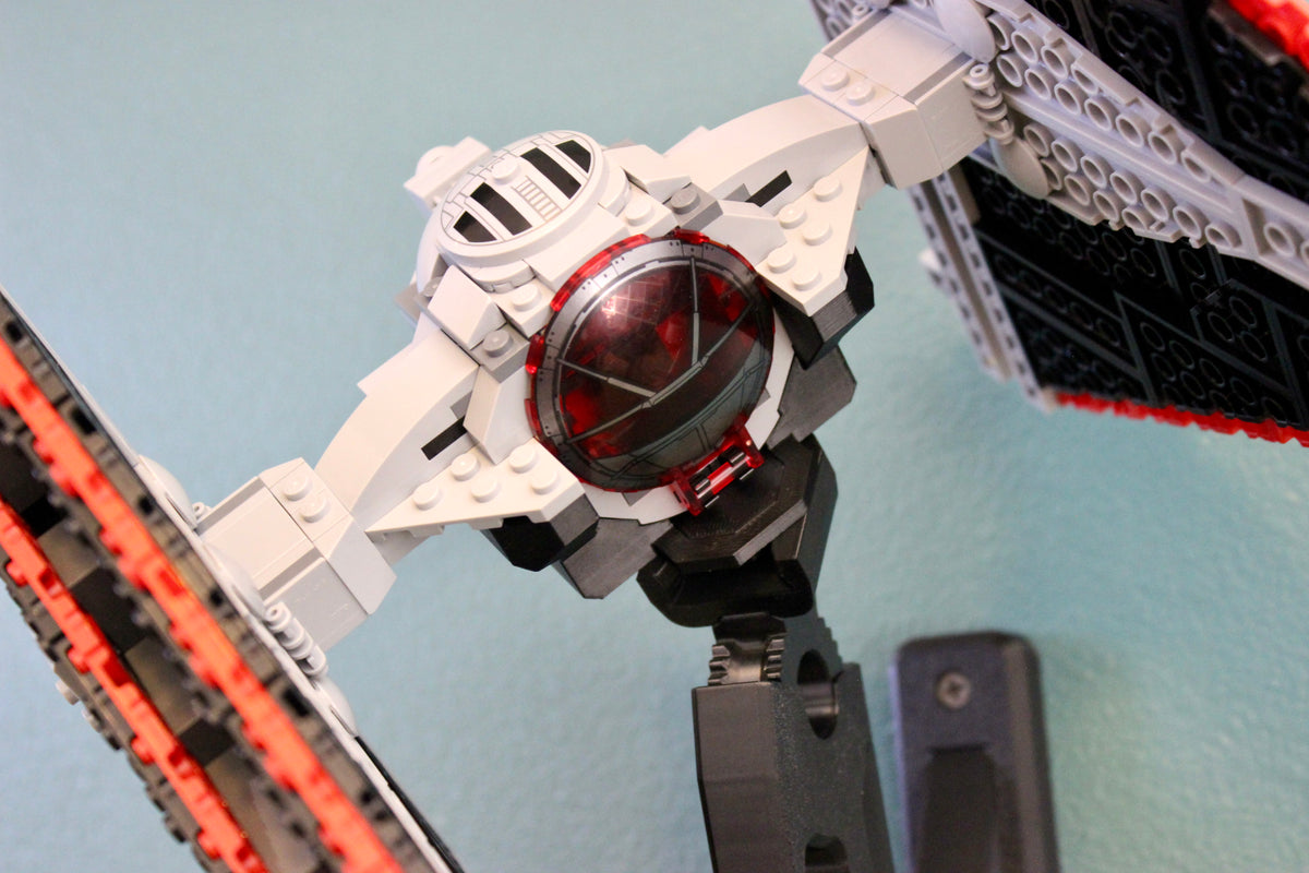 Close-up of the LEGO Sith TIE Fighter 75272 cockpit on its black wall mount