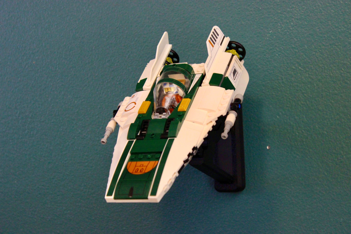 LEGO Resistance A-Wing Starfighter 75248 tilted nose-down on its wall mount