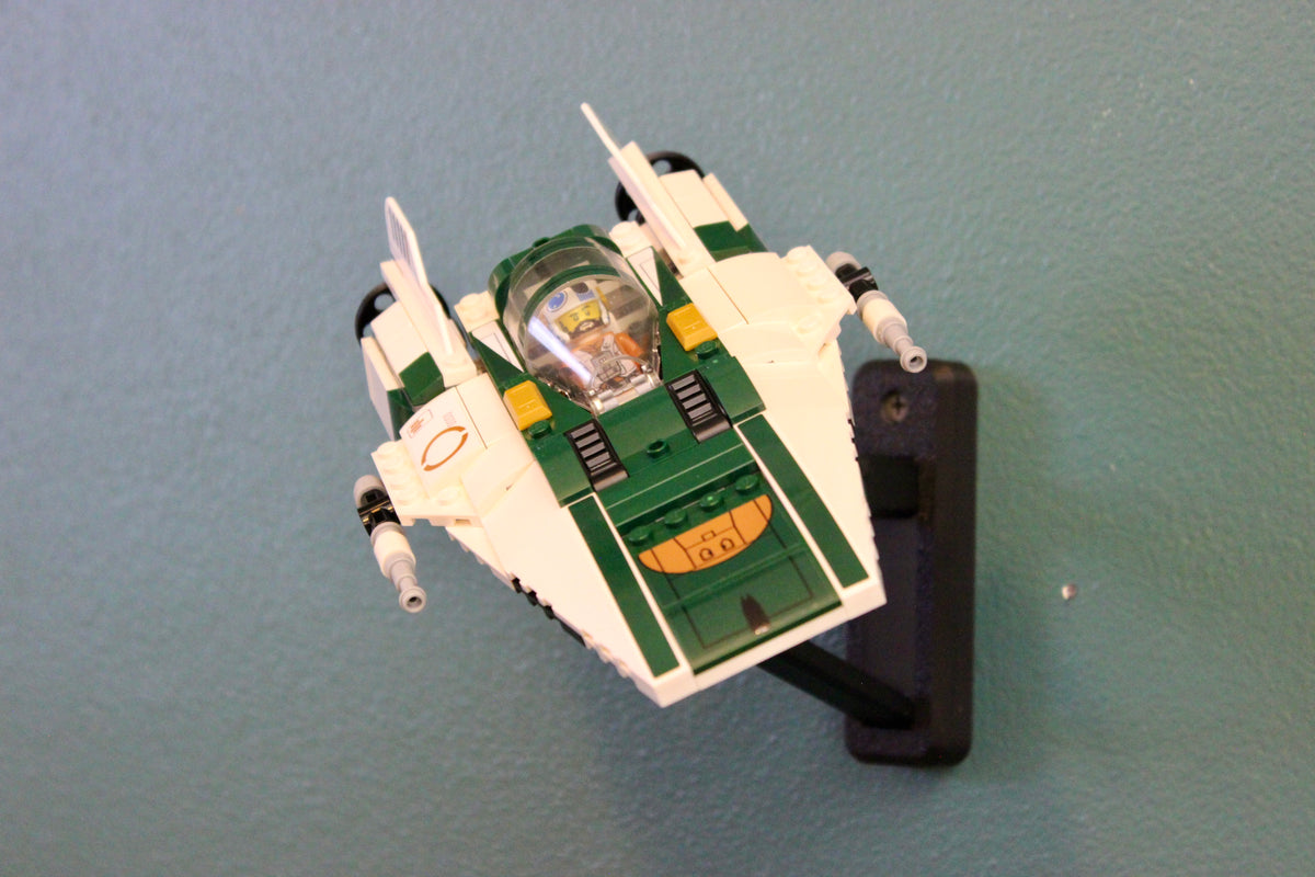 LEGO Resistance A-Wing Starfighter 75248 tilted on the black wall mount, angled view