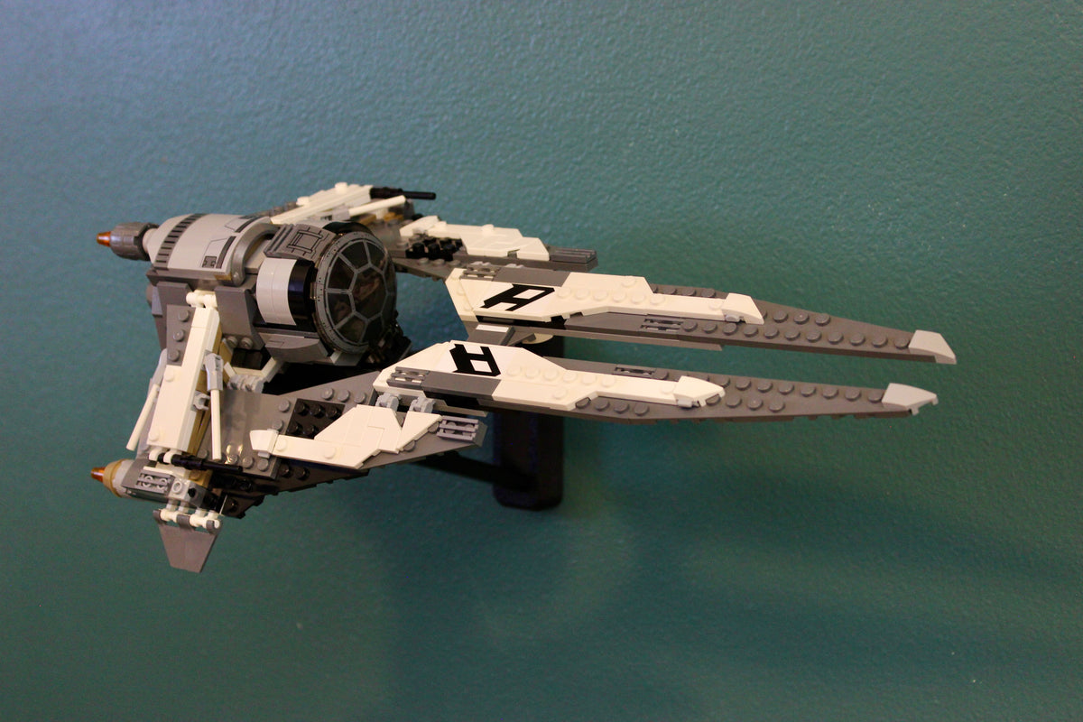 LEGO Black Ace TIE Interceptor 75242 on the wall mount, angled to show its long wings